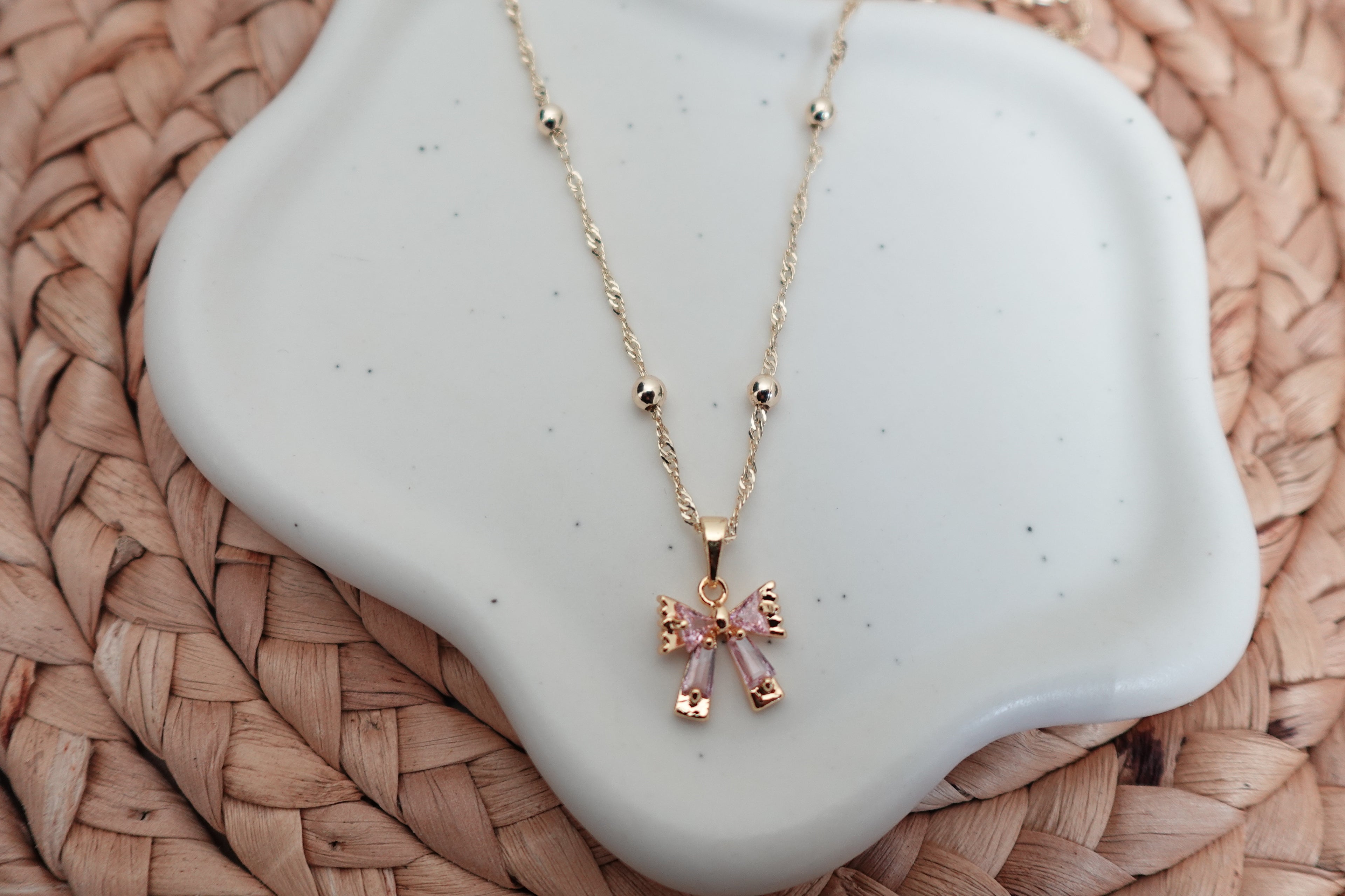 Mini pink bow necklace
